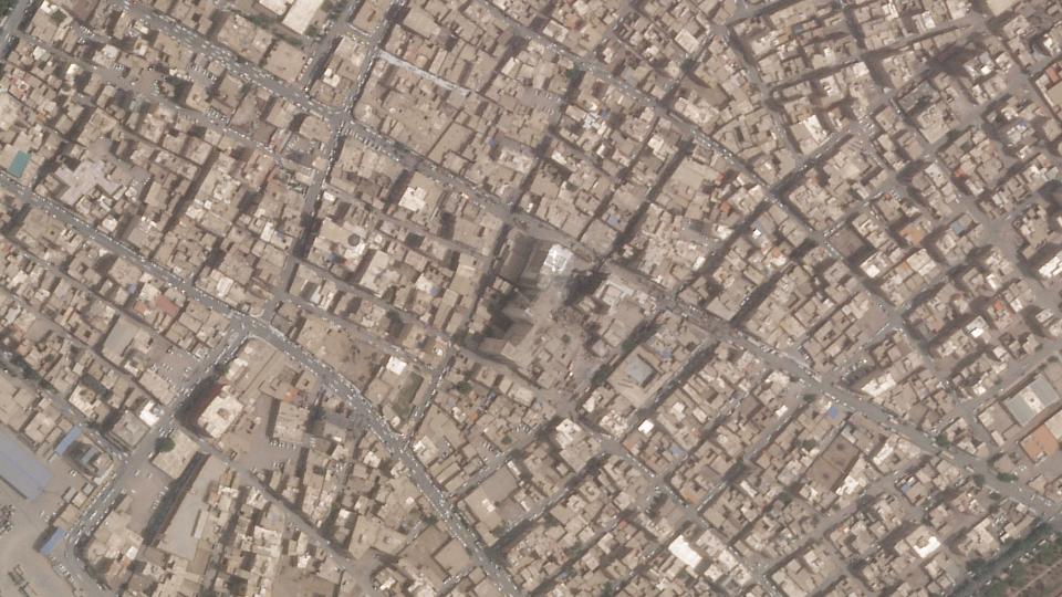 This satellite photo from Planet Labs PBC shows the Metropol Building collapse site, center, in Abadan, Iran, Thursday, May 26, 2022. Iranian riot police fired tear gas and shot into the air to disperse an angry crowd of hundreds of people near the site of the building collapse in the southwestern city of Abadan, online video analyzed Saturday, May 28, 2022, showed. (Planet Labs PBC via AP)