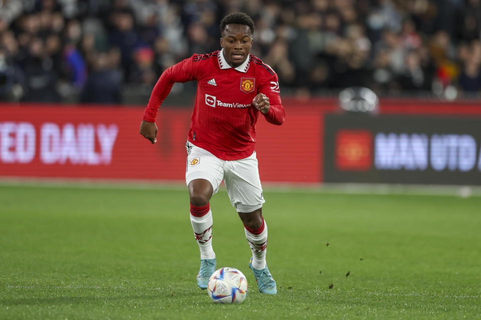 Manchester United's Ethan Laird runs with the ball during the soccer match between Manchester United and Melbourne Victory at the Melbourne Cricket Ground, Australia, Friday, July 15, 2022. (AP Photo/Asanka Brendon Ratnayake)