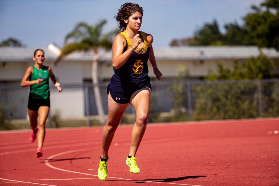 Gianna Del Pizzo of Lehigh Senior High School leads the girls 1600 during the LCAC Track and Field Championships at Cypress Lake High School on Wednesday, April 17, 2024. She won. Masha Dorfeev of Fort Myers was second.