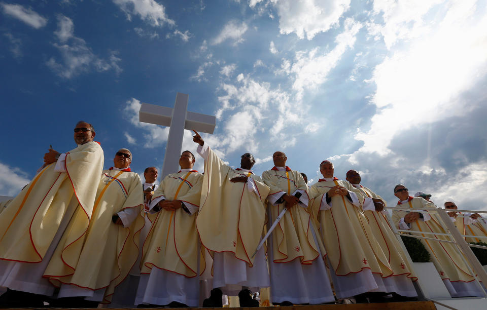 Clergy members wait for Pope Francis