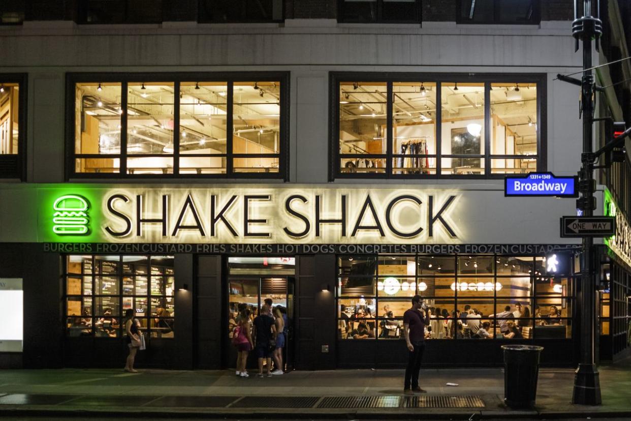 An image of the outside of a Shake Shack restaurant.