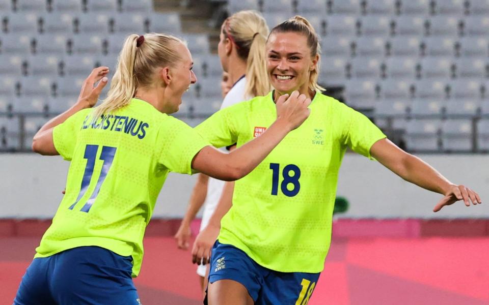 Sweden's forward Stina Blackstenius (L) celebrates with Sweden's forward Fridolina Rolfo after scoring the second goa - AFP