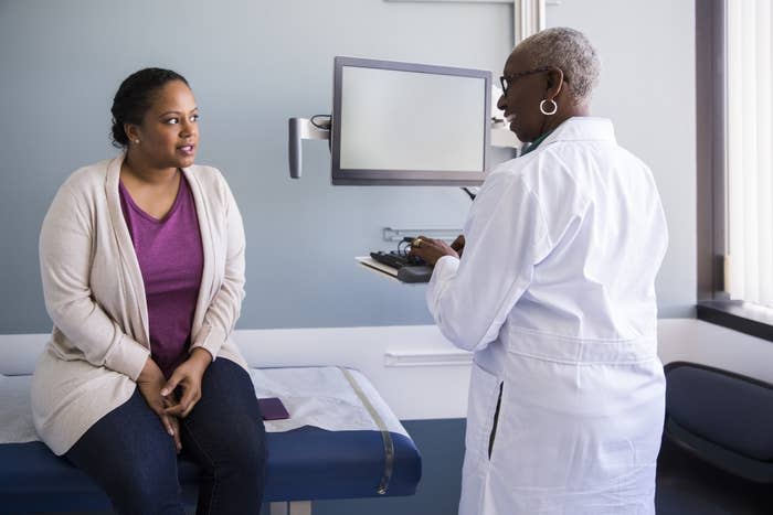 A woman talking with her doctor