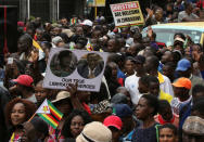 Protesters calling for Zimbabwean President Robert Mugabe to step down take to the streets in Harare, Zimbabwe November 18, 2017. REUTERS/Philimon Bulawayo