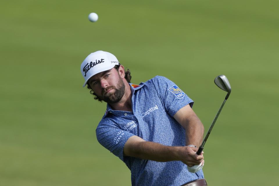 Cameron Young of the U.S. plays his third shot on 18th hole during the second round of the Hero Dubai Desert Classic golf tournament, in Dubai, United Arab Emirates, Friday, Jan. 19, 2024. (AP Photo/Kamran Jebreili)