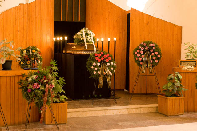 Wooden caseket at a funeral - altar, burial, bury, bye, casket, church, coronar, cremation, cross, death, die, family, flower, f