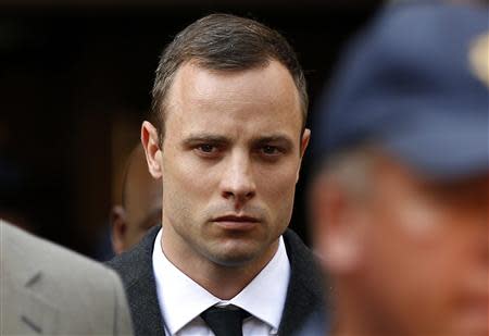 Oscar Pistorius leaves after attending his trial at the high court in Pretoria April 7, 2014. REUTERS/Siphiwe Sibeko