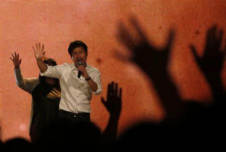 Worshippers attend a church service at the City Harvest Church in Singapore March 1, 2014. REUTERS/Edgar Su