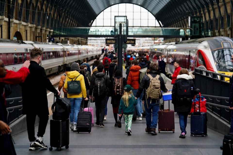 Passengers on platforms at King’s Cross Station n Friday (Jordan Pettitt/PA Wire)