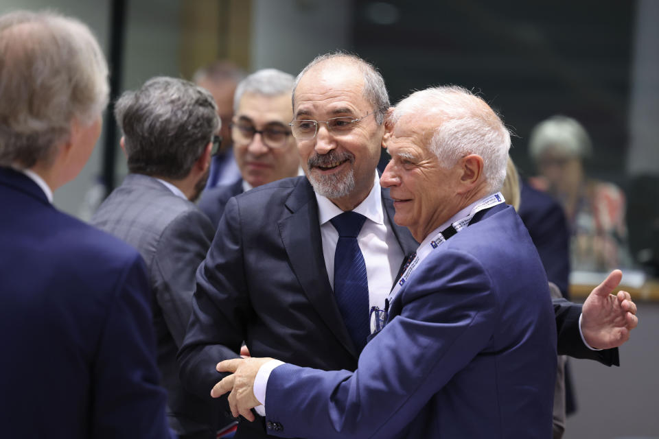 European Union foreign policy chief Josep Borrell, right, greets Jordan's Minister for Foreign Affairs Ayman Safadi during a meeting 'Supporting the future of Syria and the region' at the European Council building in Brussels, Thursday, June 15, 2023. Aid agencies will struggle to draw the world's attention back to Syria at an annual donor conference hosted by the European Union in Brussels for humanitarian aid to Syrians. (AP Photo/Geert Vanden Wijngaert)