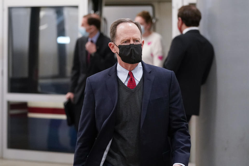 Sen. Pat Toomey, R-Pa., walks on Capitol Hill in Washington, Saturday, Feb. 13, 2021, on the fifth day of the second impeachment trial of former President Donald Trump. (AP Photo/Alex Brandon)