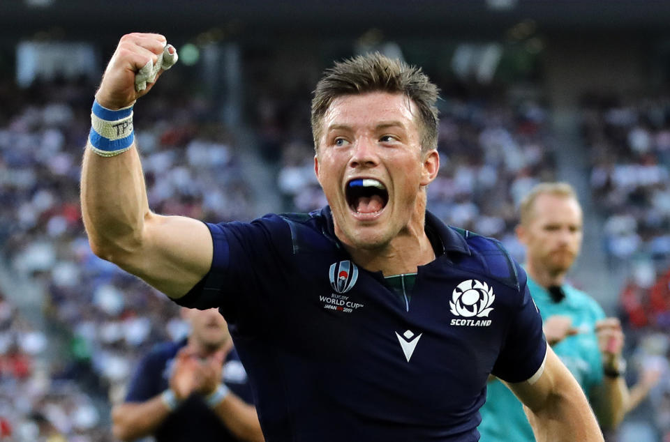 Scotland's George Horne celebrates after scoring a try during the Rugby World Cup Pool A game at Shizuoka Stadium Ecopa between Scotland and Russia in Shizuoka, Japan, Wednesday, Oct. 9, 2019. (AP Photo/Christophe Ena)