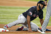 Cleveland Guardians' Amed Rosario gets back to third base, beating a pickoff throw during the fourth inning of a baseball game against the Texas Rangers in Arlington, Texas, Friday, Sept. 23, 2022. (AP Photo/LM Otero)