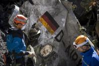 French rescue workers inspect the crash site of the doomed Germanwings flight which smashed in the French Alps on March 24, killing all 150 people on board