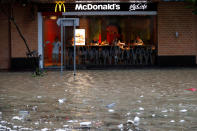 <p>A flooded street is seen outside a McDonalds restaurant as Typhoon Hato hits Hong Kong, China, Aug. 23, 2017. (Photo: Tyrone Siu/Reuters) </p>