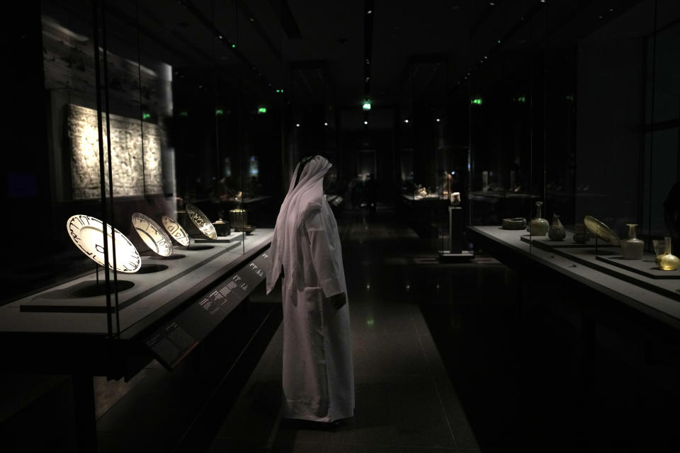 A man stands inside the Museum of Islamic Art in Doha, Qatar, Tuesday, Nov. 22, 2022. (AP Photo/Christophe Ena)