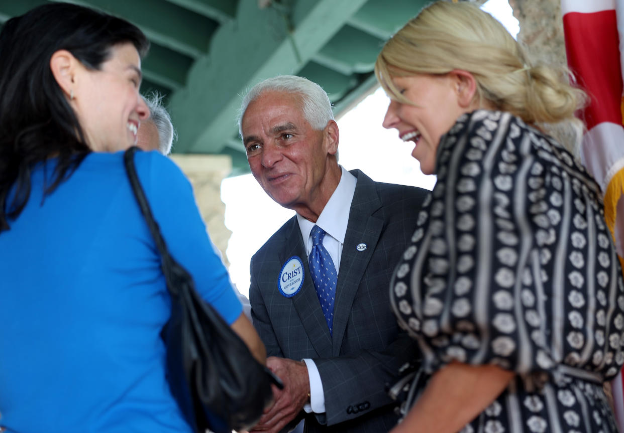 Charlie Crist, the Democratic gubernatorial candidate for Florida, and his fiancée, Chelsea Grimes, during a campaign stop on Oct. 17 in Miami. 
