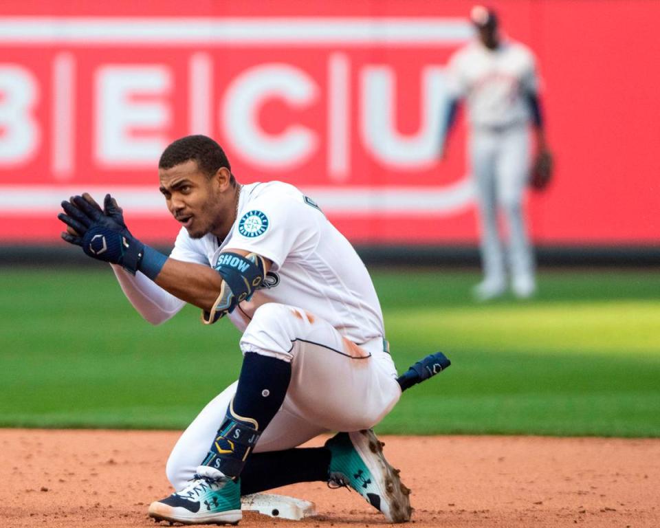 Seattle Mariners center fielder Julio Rodriguez (44) cheers on his team from second base after hitting a double in the bottom of the eighth inning of game 3 of the ALDS against the Houston Astros on Saturday, Oct. 15, 2022, at T-Mobile Park in Seattle.