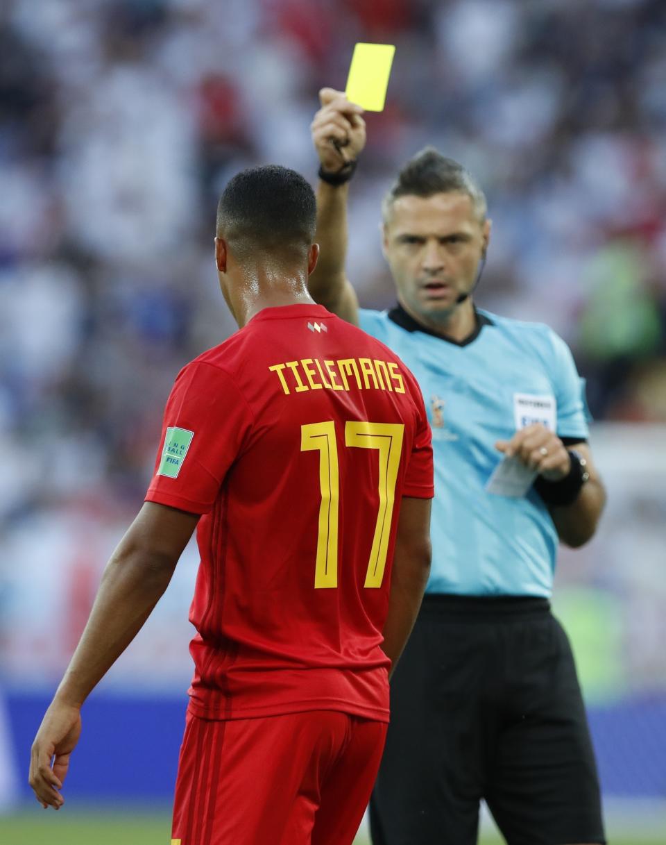 <p>With fair play featuring so prominently in the outcome of Group E, referee Damir Skomina shows the yellow card to Belgium’s Youri Tielemans </p>