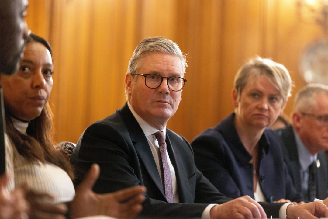 Britain's Prime Minister Keir Starmer, listens as Idris Elba, left, speaks during the knife crime summit hosted by Starmer at 10 Downing Street, in London, Monday Sept. 9, 2024. (Ian Vogler/Pool Photo via AP)