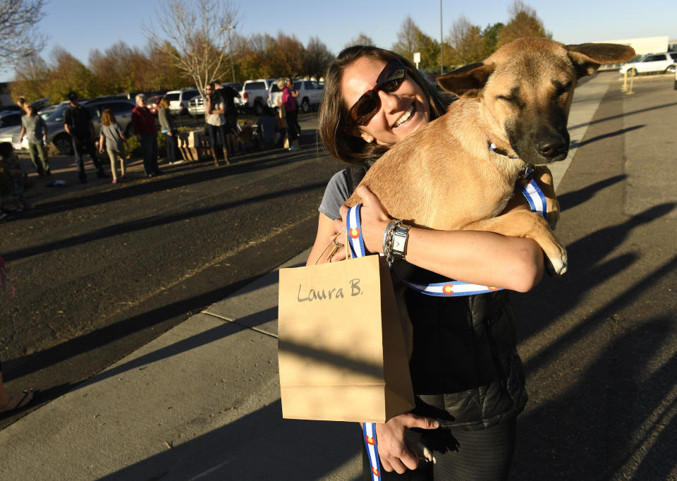  3: Laura Burnham meets her new foster dog Coconut after she and 31 other dogs, rescued from Thailand,  arrived at Rocky Mountain Metropolitan Airport after a 27 hour journey from Thailand on November 3, 2016 in Broomfield, Colorado. The 32 dogs were rescued from the meat trade in Thailand and brought over with the help of Underdogs Animal Rescue based in Boulder.  This is the first such effort to bring in animals from a foreign country by the foster-based rescue.  The rescue worked with Elephant Nature Park, an elephant and dog rescue near Chiang Mai, Thailand, to bring the dogs to a better life in Colorado.  The shelter in Thailand had 470 dogs with not great hope for a better life off the streets, out of the shelter or finding a home.  Often street dogs are sold into the meat trade in surrounding countries. In places such as Mexico, China, Indonesia, Korea and the Philippines, it is common to eat dogs.  The meat is so popular that the city of Yulin, China hosts an annual Dog Meat Festival where an estimated 10,000 to 15,000 dogs are tortured, killed, cooked and served to the public during the festival.  The dogs will all be in foster homes and are available through the rescue. Contact Megan Weber at Megan@underdogsrescue.org. (Photo by Helen H. Richardson/The Denver Post via Getty Images)
