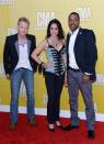 NASHVILLE, TN - NOVEMBER 01: (L-R) Nick Hoffman, Krista Marie, and Damien Horne of The Farm attend the 46th annual CMA Awards at the Bridgestone Arena on November 1, 2012 in Nashville, Tennessee. (Photo by Jason Kempin/Getty Images)