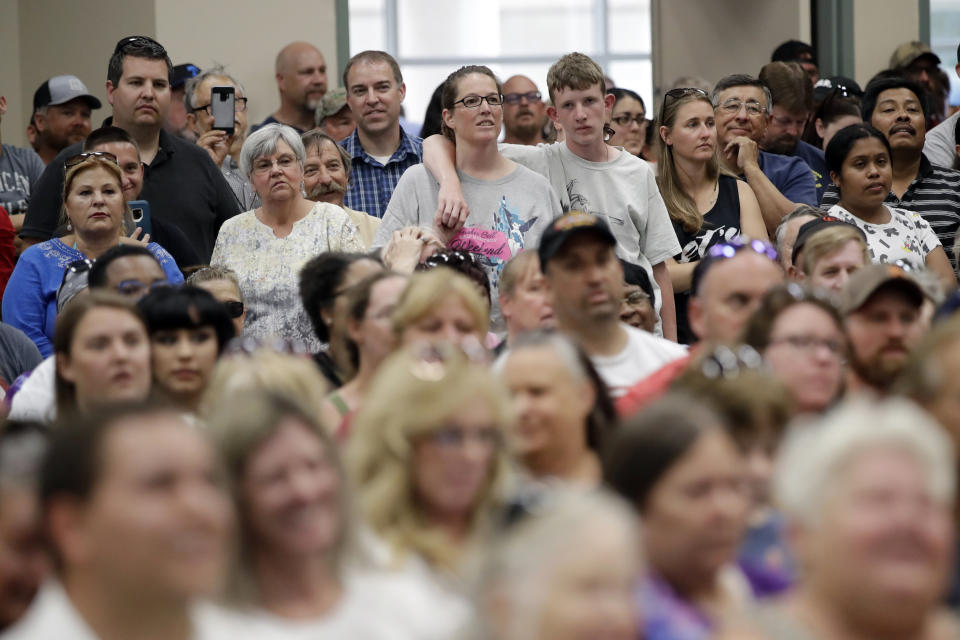 A crowd listens to an official during an informational town hall for residents following recent earthquakes Sunday, July 7, 2019, in Ridgecrest, Calif. (AP Photo/Marcio Jose Sanchez)