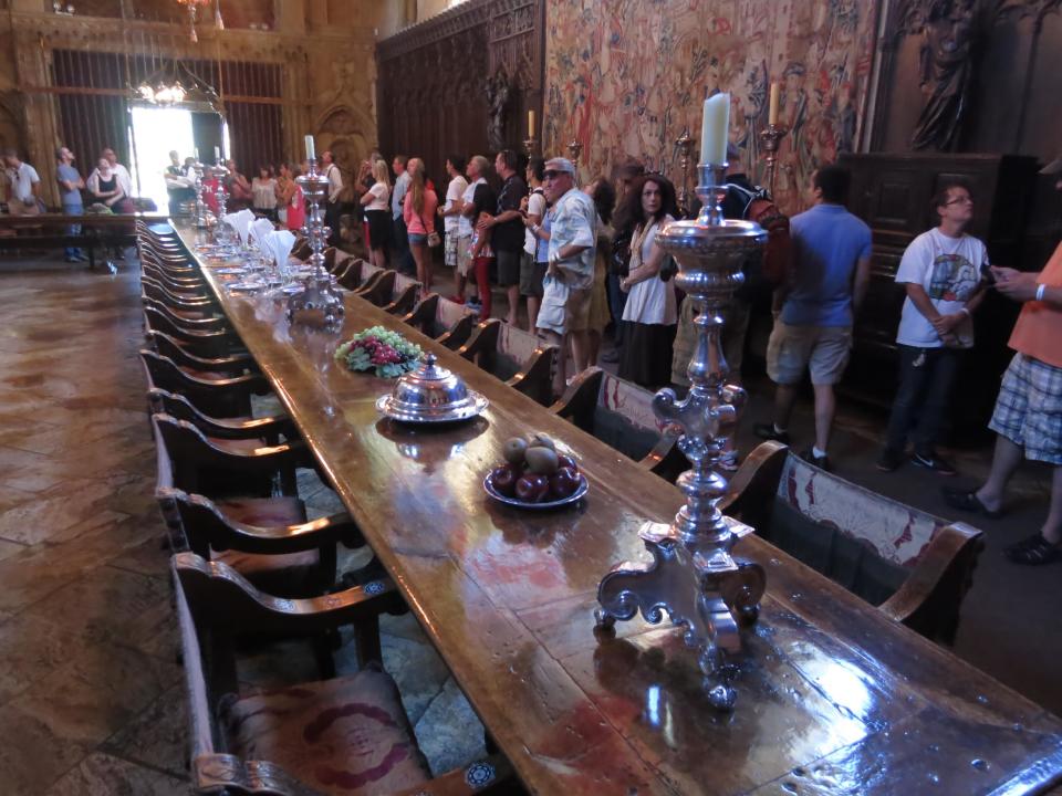 This Aug. 30, 2013 photo shows visitors touring the dining room of newspaper publisher William Randolph Hearst's 165-room estate, which he called "La Cuesta Encantada" ("The Enchanted Hill") in San Simeon, Calif. The property, now known as the Hearst Castle, overlooks the Pacific Ocean. (AP Photo/Jim MacMillan)