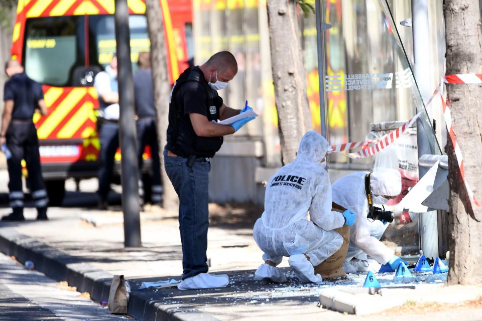 <p>French forensic police search the site following a car crash on Aug. 21, 2017, in the southern Mediterranean city of Marseille. (Photo: Boris Horvat/AFP/Getty Images) </p>