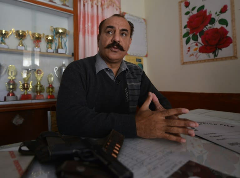 Pakistani headmaster Naveed Gul says weapons in school give him confidence