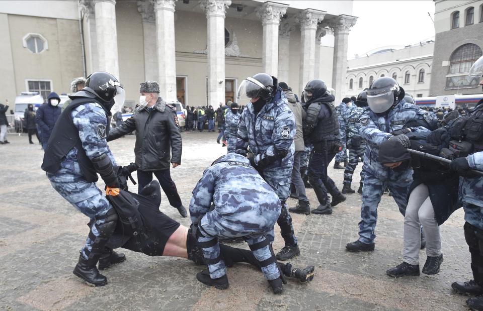 Police detain protesters during a protest against the jailing of opposition leader Alexei Navalny in Moscow, Russia, Sunday, Jan. 31, 2021. Thousands of people took to the streets Sunday across Russia to demand the release of jailed opposition leader Alexei Navalny, keeping up the wave of nationwide protests that have rattled the Kremlin. Hundreds were detained by police. (AP Photo/Dmitry Serebryakov)