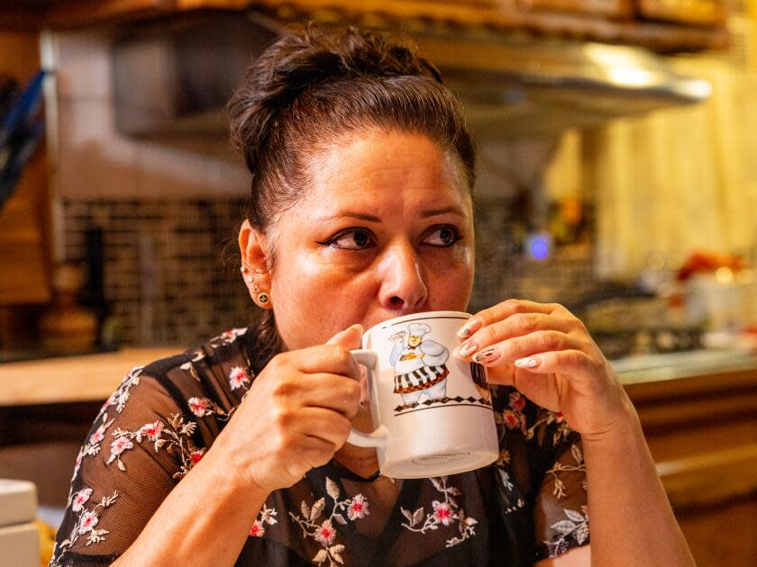 Maria Del Pilar Barradas-Medel has her morning coffee before heading to her job.