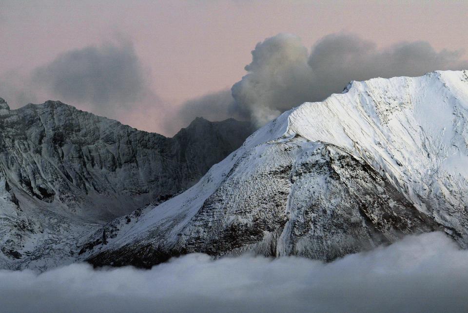 Steam rises from the crater of Mount Saint Helens volcano Oct. 10, 2004, in Washington. Seismic activity at the time had slowed, prompting a downgrade from level three to level two warning that an eruption is likely though not imminent. In 1980, seismic activity slowed in a similar fashion shortly before the volcano exploded, blowing the top off the mountain with a blast heard 200 miles away and causing the largest landslide ever recorded. The 1980 eruption leveled hundreds of square miles of forest, killed 57 people, and sent volcanic ash around the world. (Photo by David McNew/Getty Images)