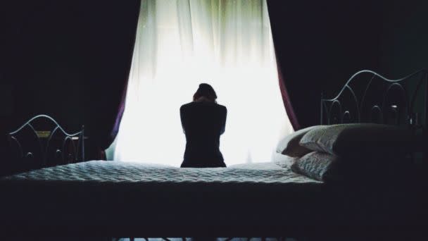 PHOTO: A woman on a bed in an undated stock photo. (STOCK PHOTO/Getty Images)