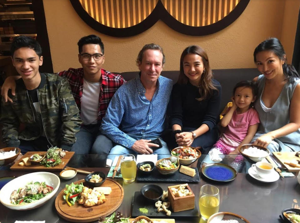 Ms Teng, pictured with her family, said on board the flight became “chaotic” after the air-conditioning was turned off. Photo: Supplied