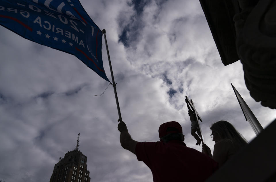 Trump supporters protest the presidential election results on the steps of the State Capitol in Lansing, Mich., Sunday, Nov. 8, 2020. (AP Photo/David Goldman)