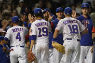 The Chicago Cubs celebrate the team's 9-0 win over the Pittsburgh Pirates after a baseball game Monday, May 16, 2022, in Chicago. (AP Photo/Charles Rex Arbogast)