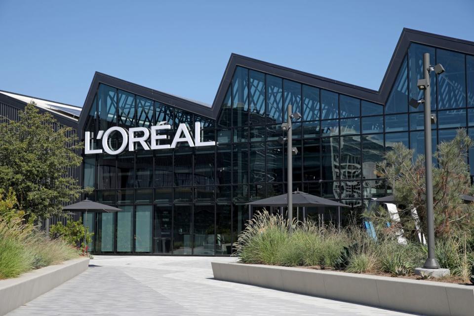Sawtooth windows illuminate L'Oréal's offices in a former airplane plant.