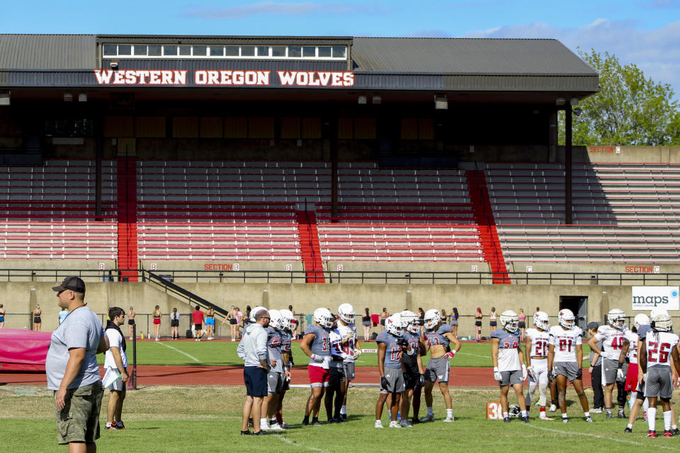 The Western Oregon college football team takes part in practice, Wednesday, Aug. 9, 2023, in Monmouth, Ore. As one of just two NCAA Division II schools with football teams on the West Coast, Western Oregon spends hundreds of thousands of dollars in travel expenses to compete in the Lone Star Conference against schools in Texas and New Mexico. (AP Photo/Tim Booth)