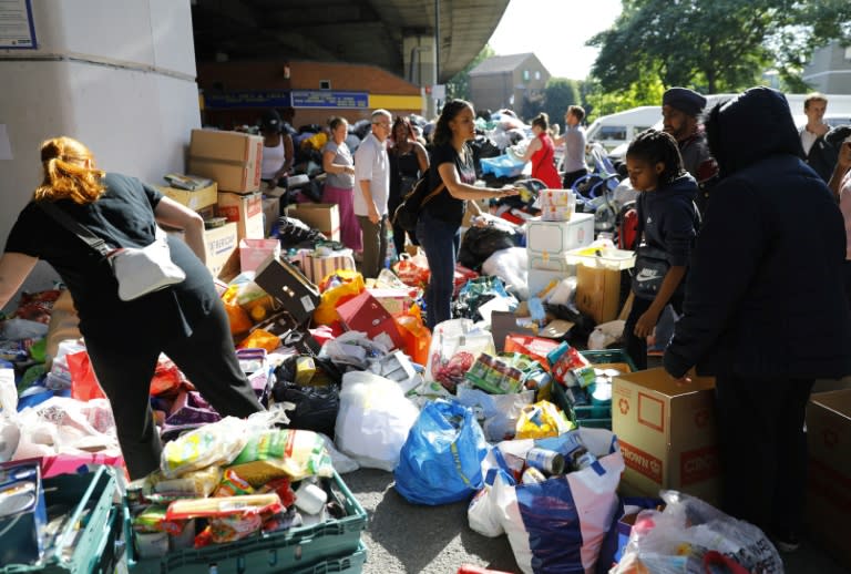 Volunteers helping to sort food and other donations to victims of the blaze at Grenfell Tower in London
