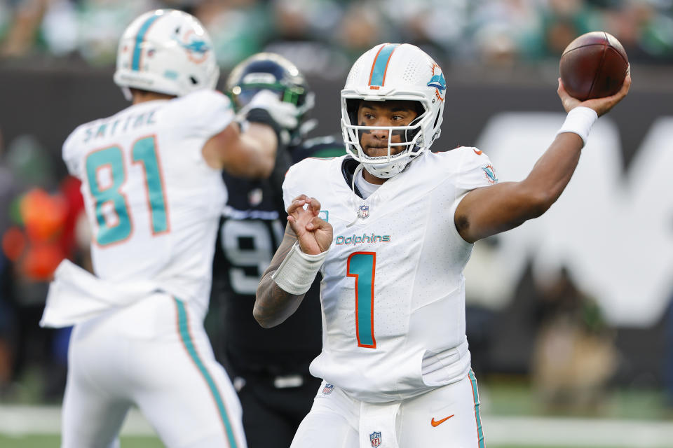 Miami Dolphins quarterback Tua Tagovailoa (1) passes against the New York Jets during the first quarter of an NFL football game, Friday, Nov. 24, 2023, in East Rutherford, N.J. (AP Photo/Noah K. Murray)