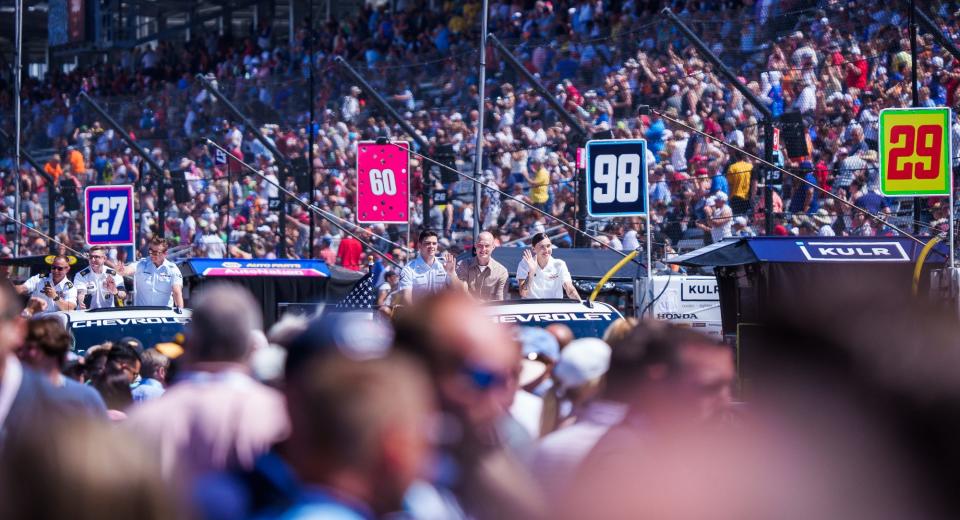 Military service members are paraded around the track Sunday, May 29, 2022, prior to the start of the 106th running of the Indianapolis 500 at Indianapolis Motor Speedway.