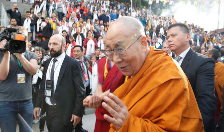 FILE PHOTO: Tibetan spiritual leader the Dalai Lama arrives for his visit to the Tibet Institute Rikon in Rikon, Switzerland September 21, 2018. REUTERS/ Arnd Wiegmann