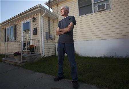 Frank Lettieri, 63, poses outside his home in the Staten Island borough of New York September 20, 2013. REUTERS/Carlo Allegri