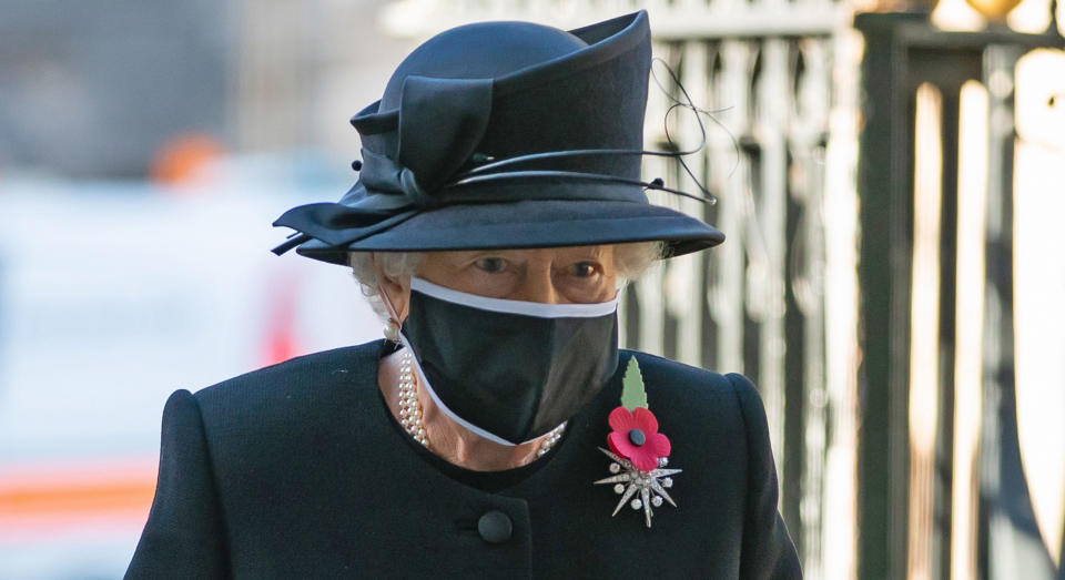 Britain's Queen Elizabeth II arrives for a service to mark the centenary of the burial of the Unknown Warrior ahead of Remembrance Sunday at Westminster Abbey in London on November 4, 2020. - In the small private ceremony, The Queen honoured the Unknown Warrior and the Royal Familys own associations with the First World War and the grave at Westminster Abbey. As part of the ceremony, a bouquet of flowers featuring orchids and myrtle - based on Her Majestys own wedding bouquet from 1947 - was placed on the grave of the Unknown Warrior in an act of remembrance. The gesture reflected the custom of Royal bridal bouquets being placed on the grave. (Photo by Aaron Chown / POOL / AFP) (Photo by AARON CHOWN/POOL/AFP via Getty Images)