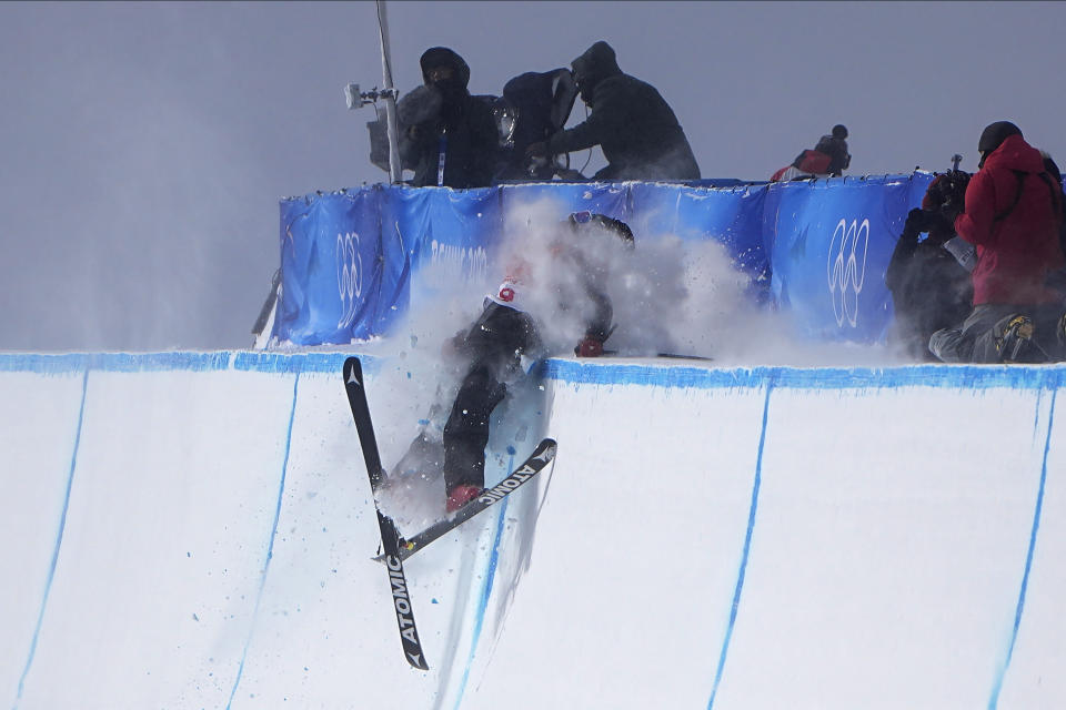 Britain's Gus Kenworthy crashes during the men's halfpipe finals at the 2022 Winter Olympics, Saturday, Feb. 19, 2022, in Zhangjiakou, China. (AP Photo/Gregory Bull)