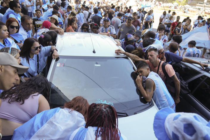 Argentina's fans listen to live commentary on the radio during the World Cup final soccer match between Argentina and France in Buenos Aires, Argentina, Sunday, Dec. 18, 2022. (AP Photo/Matilde Campodonico)