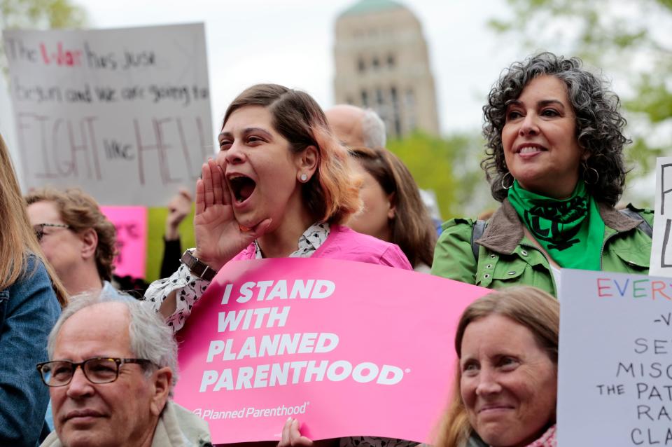 Mimi Lanseur, of Ypsilanti, left, shouts as fellow protester Claudia Annoni, of Argentina looks on during an abortion rights rally at the Diag at the University of Michigan on Tuesday, May 21, 2019. Planned Parenthood of Michigan is suing the state in an effort to nix a 1931 law that bans most abortions.