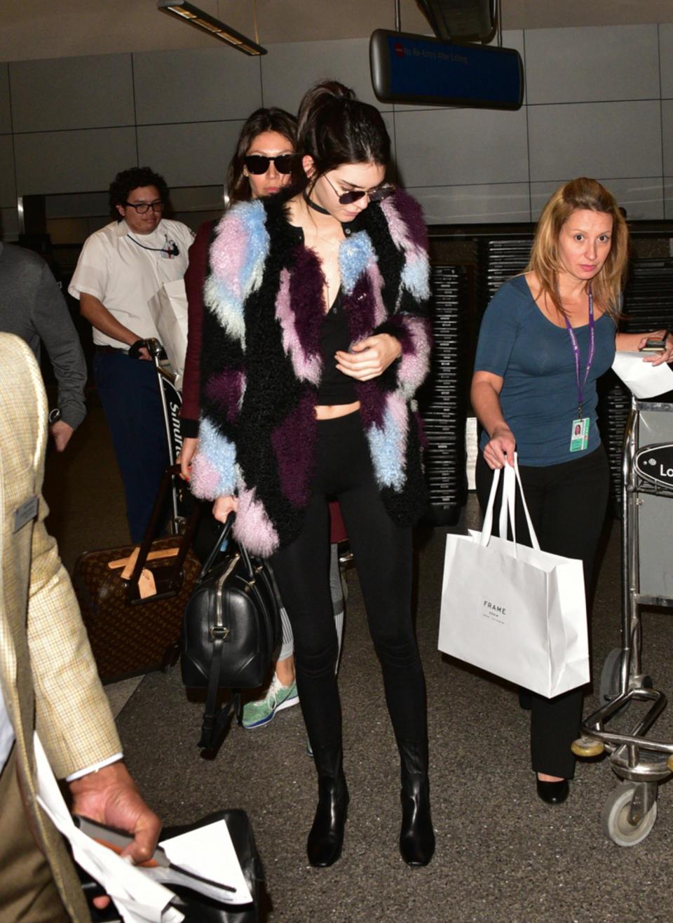 <p>Kendall proves a statement jacket is the best way to jazz up a black outfit. [Photo: Getty] </p>