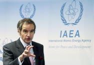 Director General of International Atomic Energy Agency, IAEA, Rafael Mariano Grossi from Argentina, addresses the media during a news conference behind plexiglass shields after a meeting of the IAEA board of governors at the International Center in Vienna, Austria, Monday, March 1, 2021. Due to restrictions related to COVID-19, it will be organised as a virtual meeting from the IAEA. (AP Photo/Ronald Zak)
